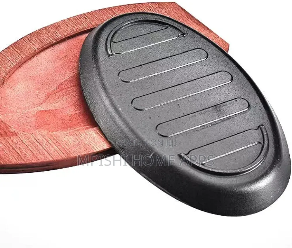 Cast Iron Hot Sizzling Plate With a Wooden Tray