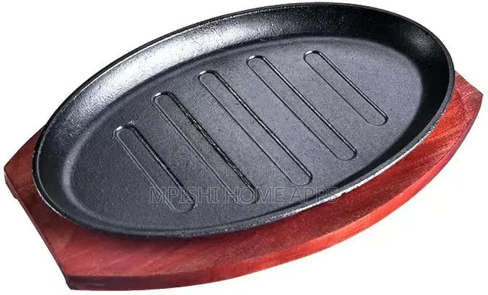 Cast Iron Hot Sizzling Plate With a Wooden Tray