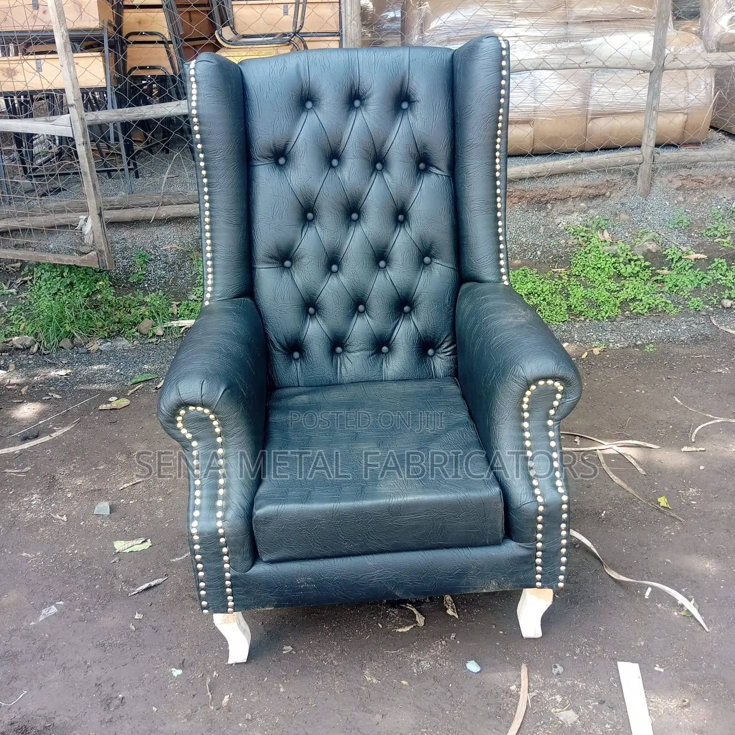 High Back Wing Chair in Black Leather.