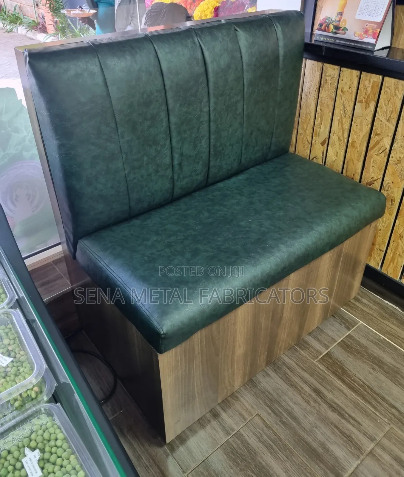 Green Restaurant Couch With a Sleek Laminate Finish.