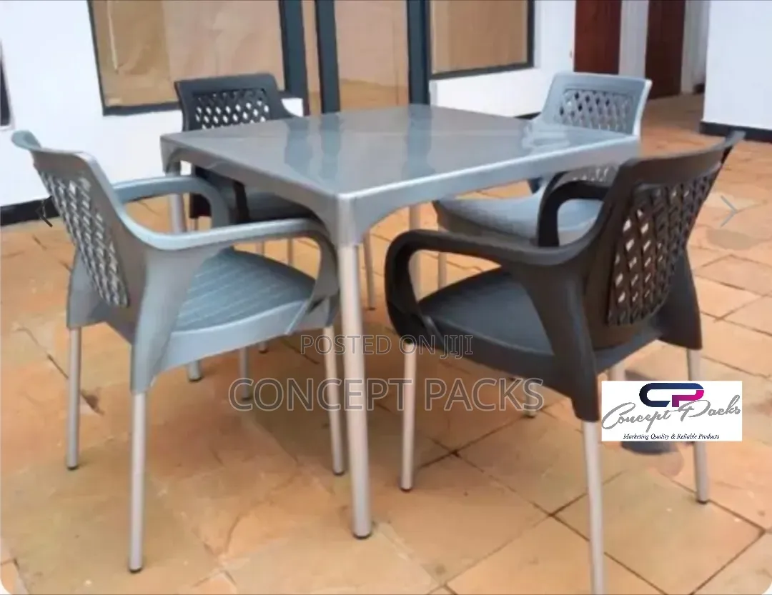 Plastic Table + 4 Chairs With Metallic Legs.