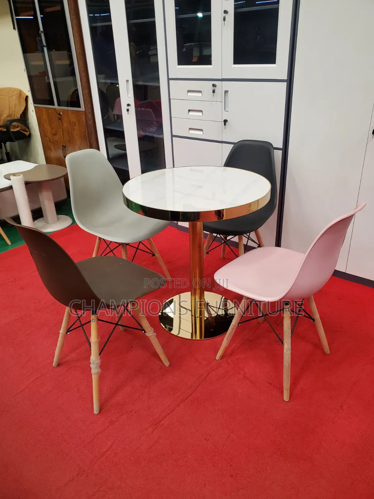 Gold Pedestal Table and Eames Chairs Set