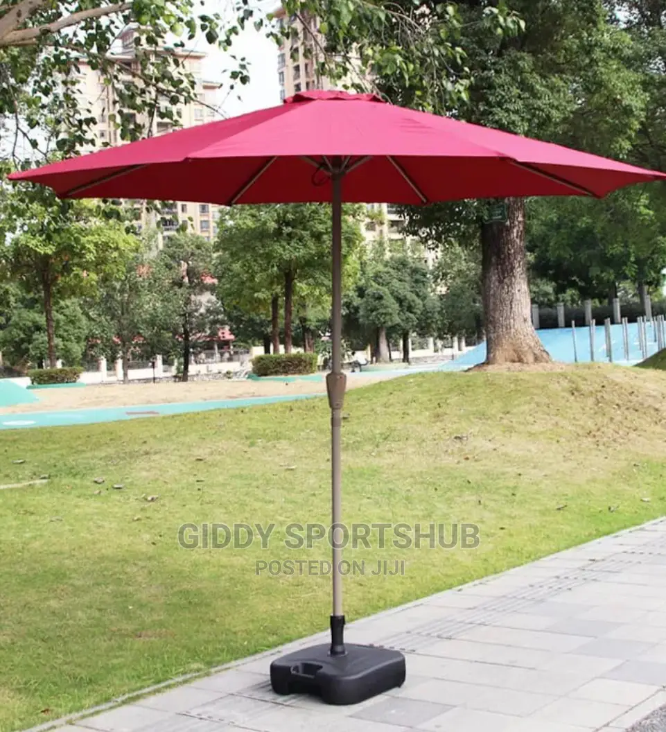 Folding an Outdoor Umbrella With an Iron Pipe