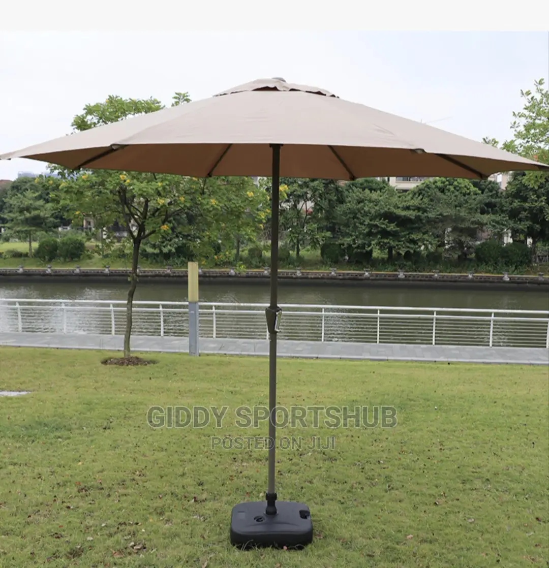 Folding an Outdoor Umbrella With an Iron Pipe