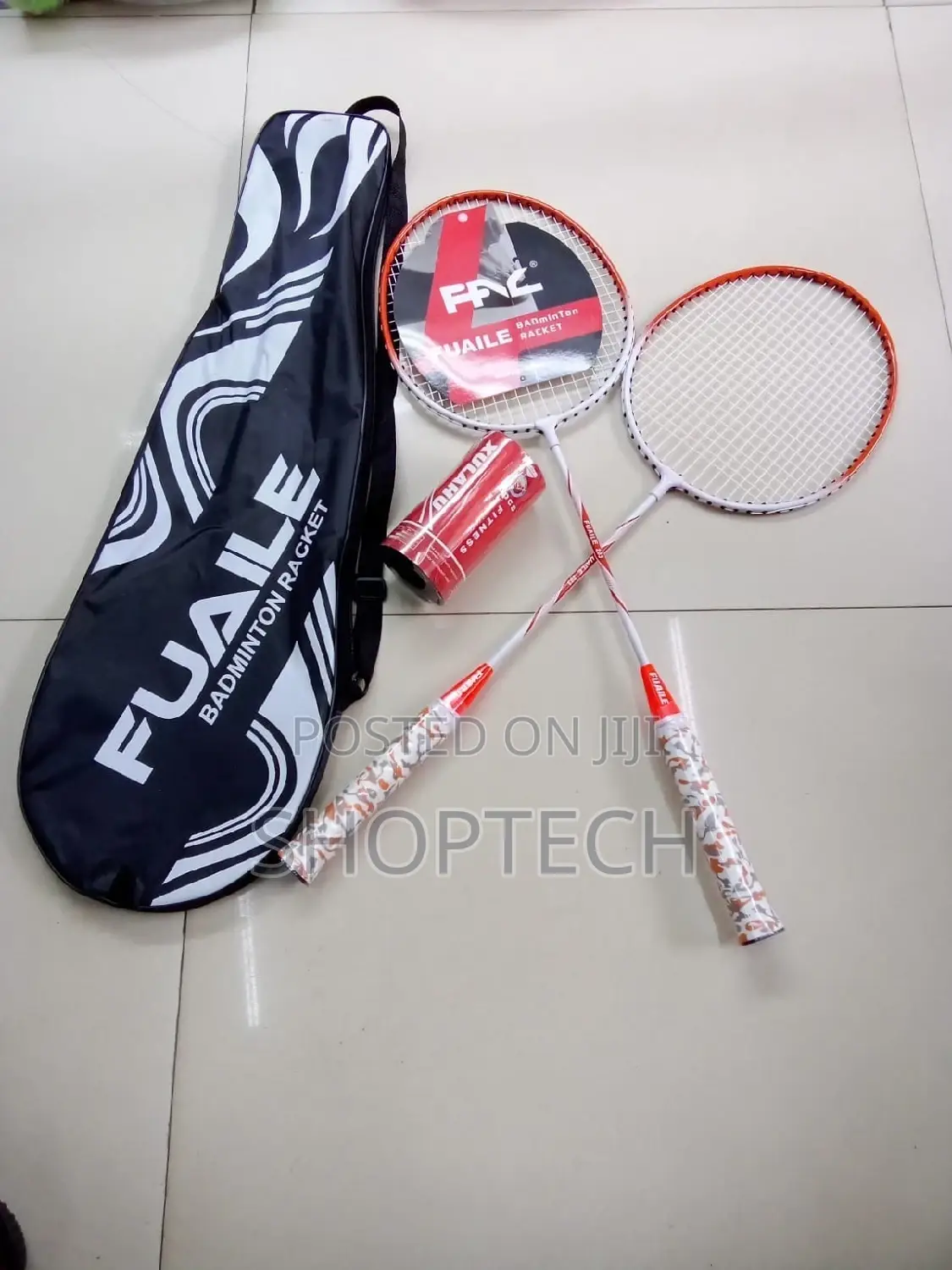 A Pair of Badminton Rackets With 2 Shuttlecocks