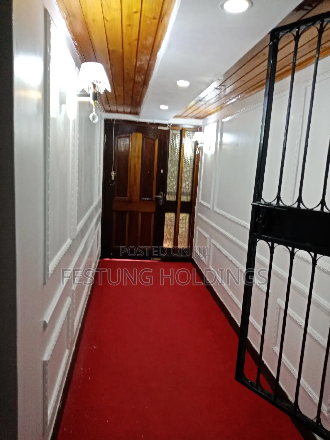 Wainscoting and Wall to Wall Red Carpet