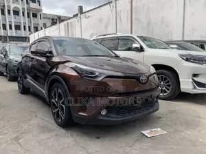 Used Brown Toyota C-HR SUV - Spacious interior, advanced safety features, and stylish looks. Ideal for families or those who love to