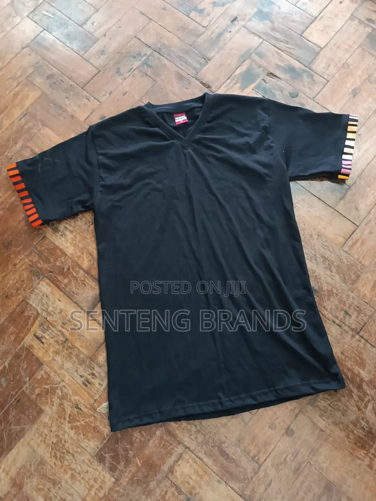 V Neck Branded With Kitenge Decorations.