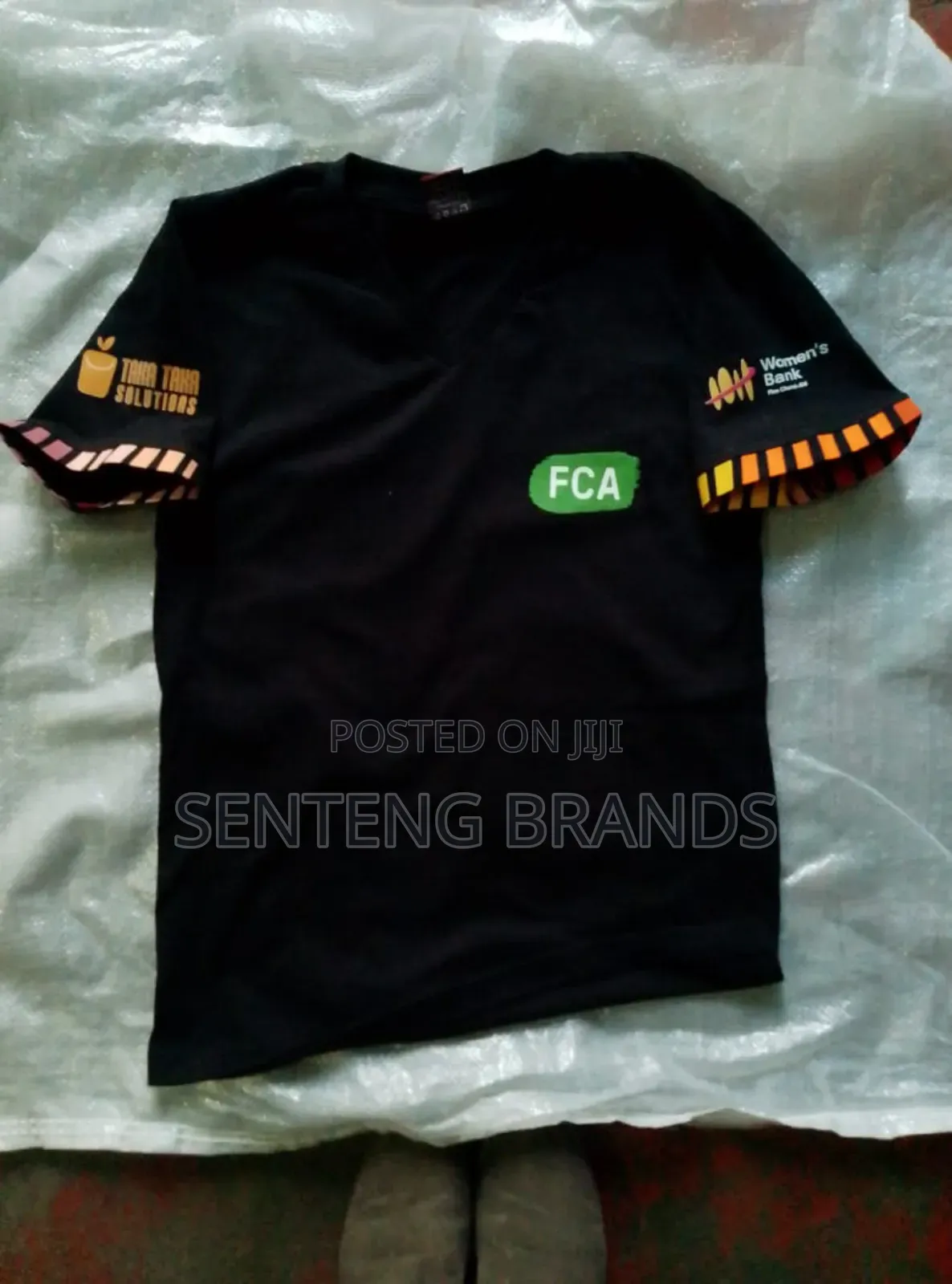 V Neck Branded With Kitenge Decorations.