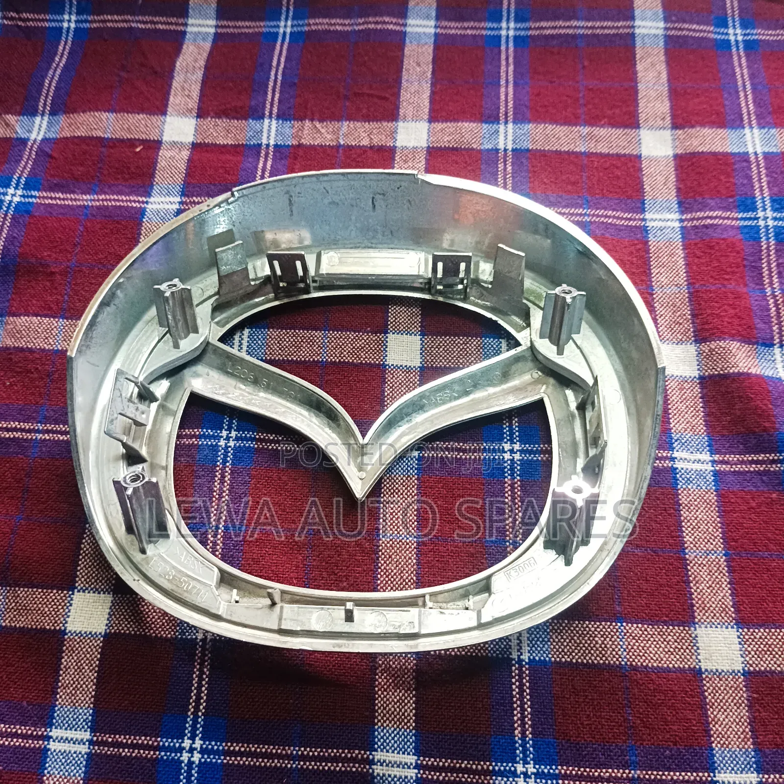Grill Logo Mazda Demio