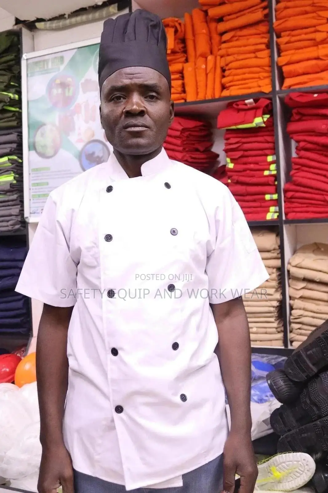 White Chef Jacket With A Black Cap
