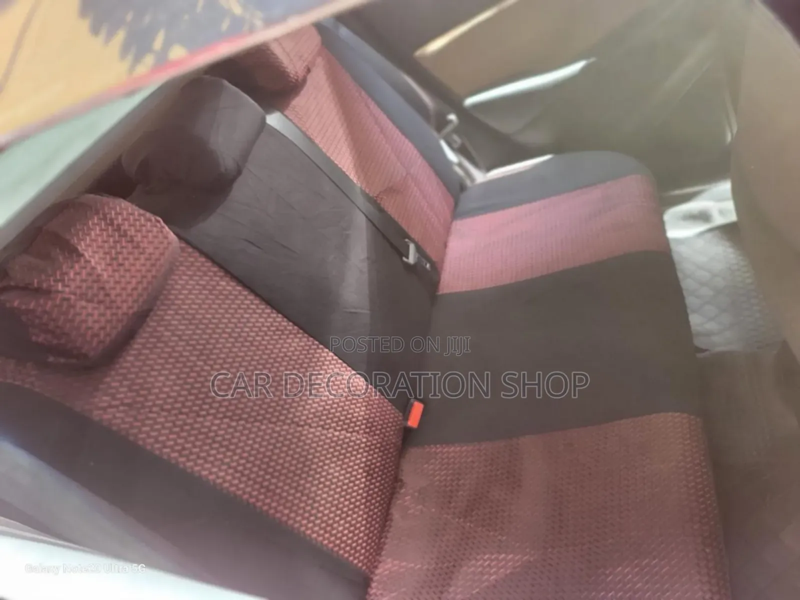 Car Fitted With Maroon Fabric Seat Cover With Leather Patch