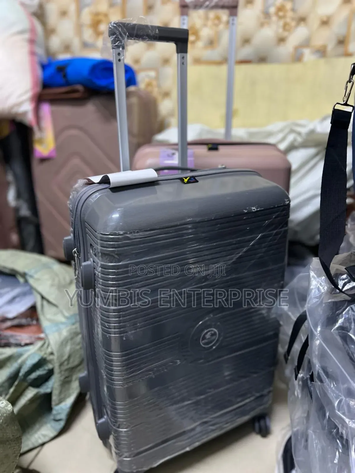 Grey Quality ____Rubber ____Suitcase Size _Medium at 4000 SHS