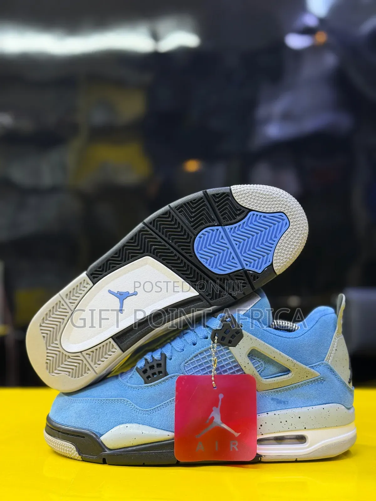 The Air Jordan 4 Retro “University Blue” Sneakers