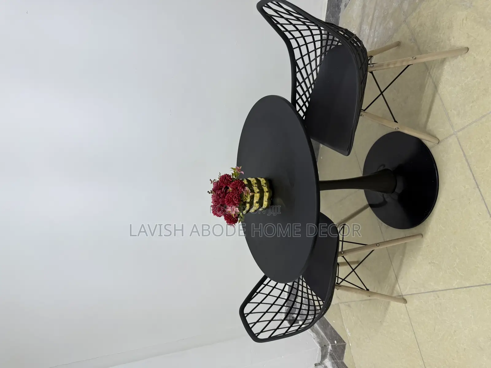 Black Table Set - A Round Table With 2 Eames Mesh Chairs
