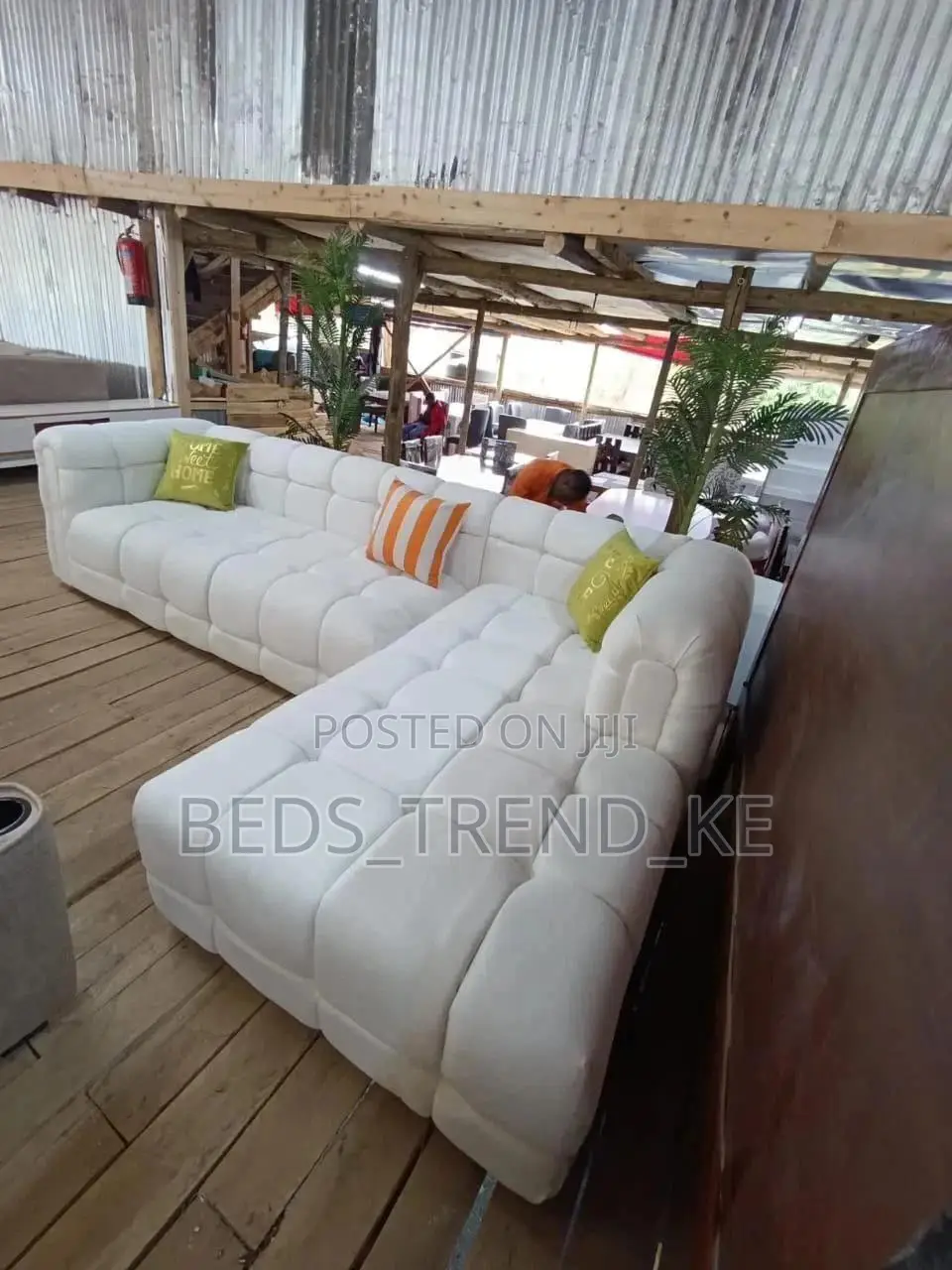 Elegant White 6 Seater L Seat With Pillows