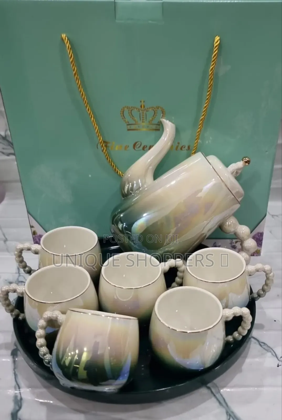 Fine Ceramic 8pc Rotating Tray Tea Set With 6 Cups and Kettle Now