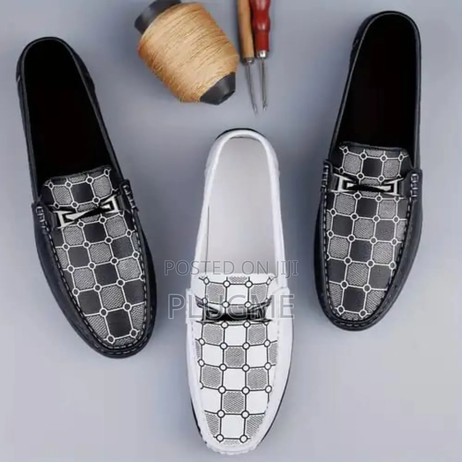 Slip-on Loafers With a Decorative Chain Detail and a Patterned Vamp.