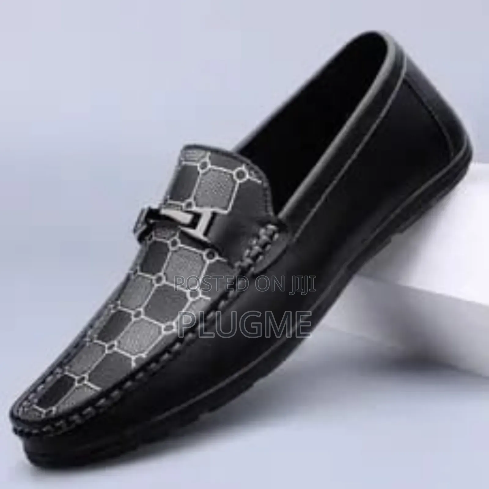 Slip-on Loafers With a Decorative Chain Detail and a Patterned Vamp.
