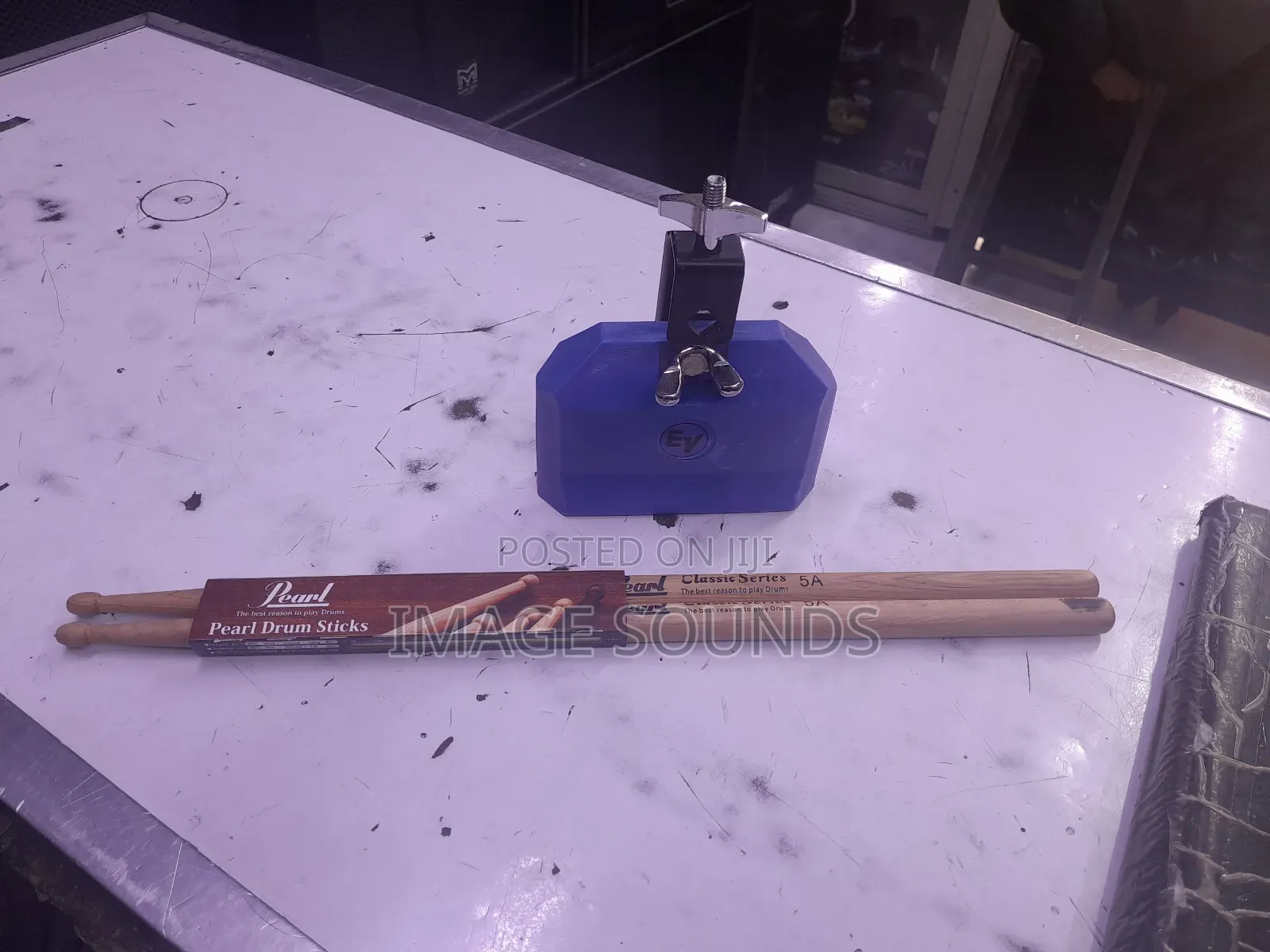 Cowbell and a Pair of Drumsticks