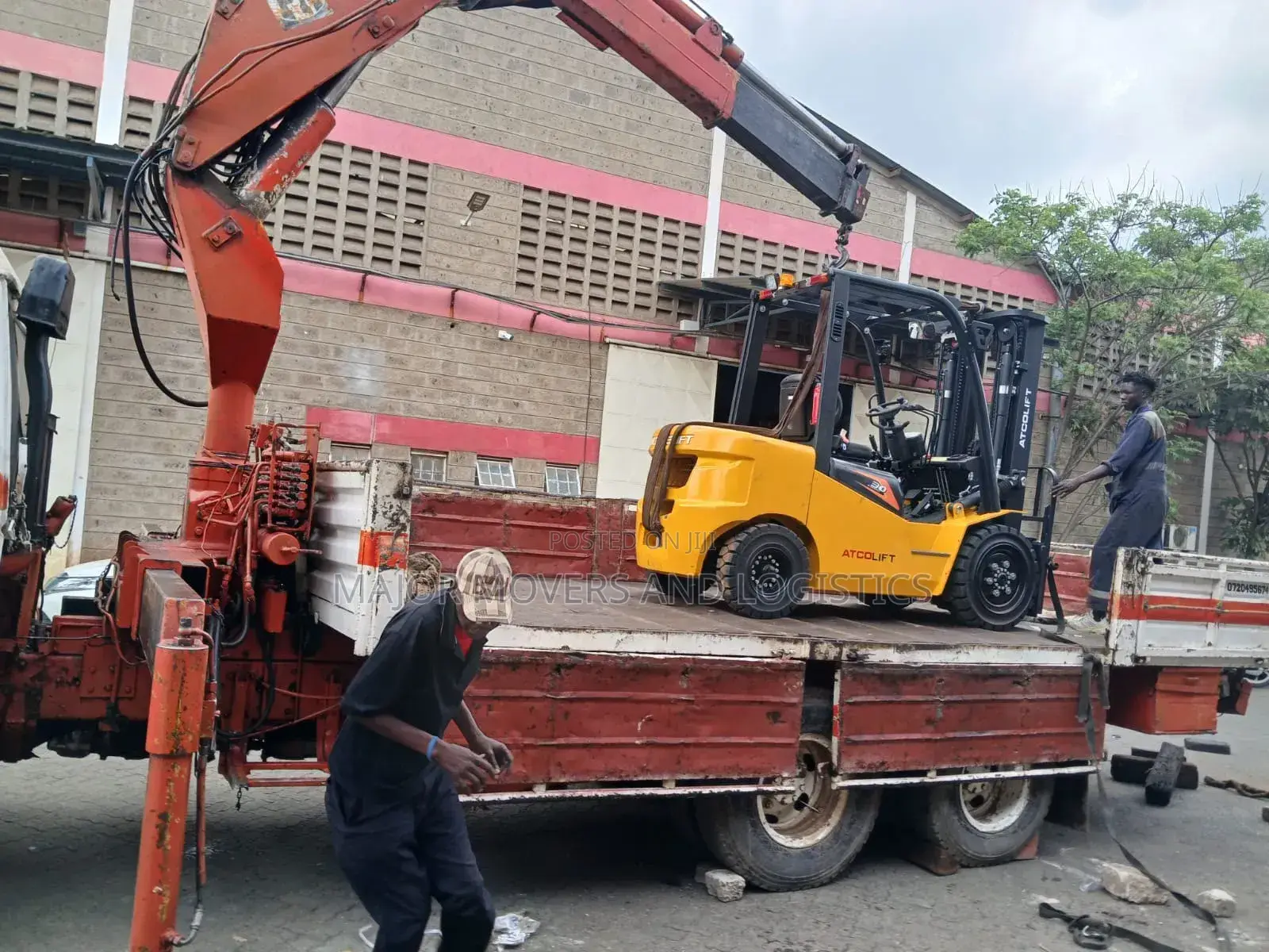 Flatbed Trailer With Crane Are at Hand for Transportation
