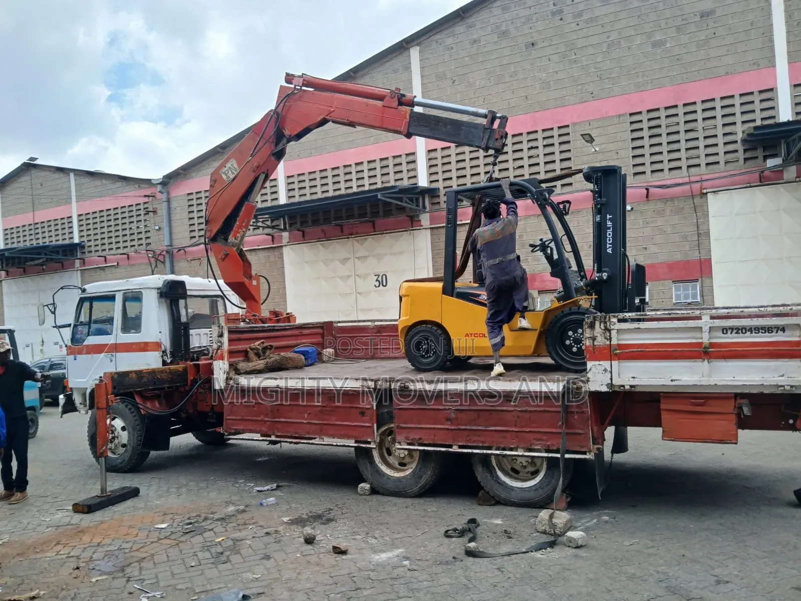 Flatbed Trailer With Crane Are Ready for Hoisting and Transportation
