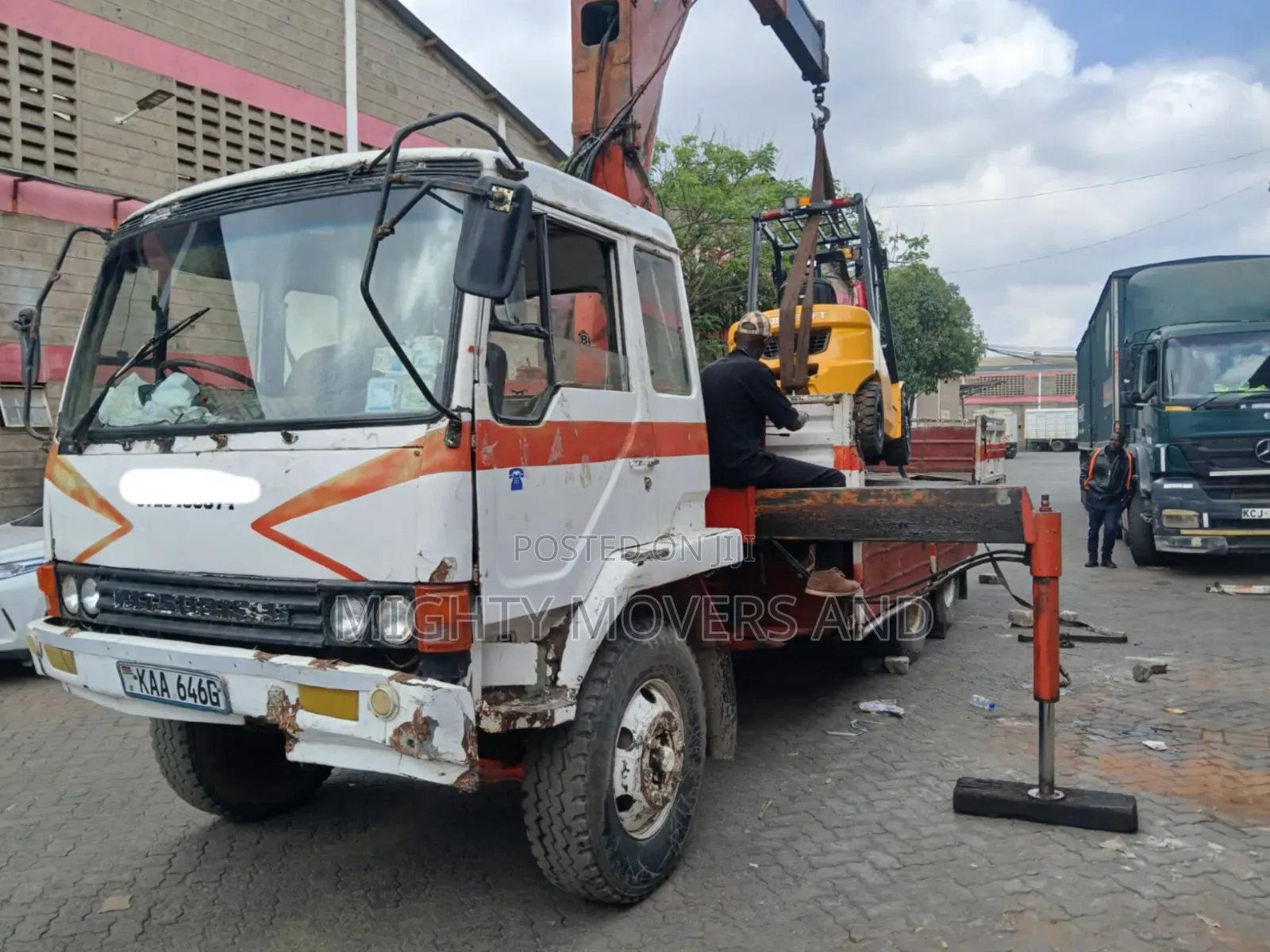 Flatbed Trailer With Crane Are at Hand Across Border Transportation