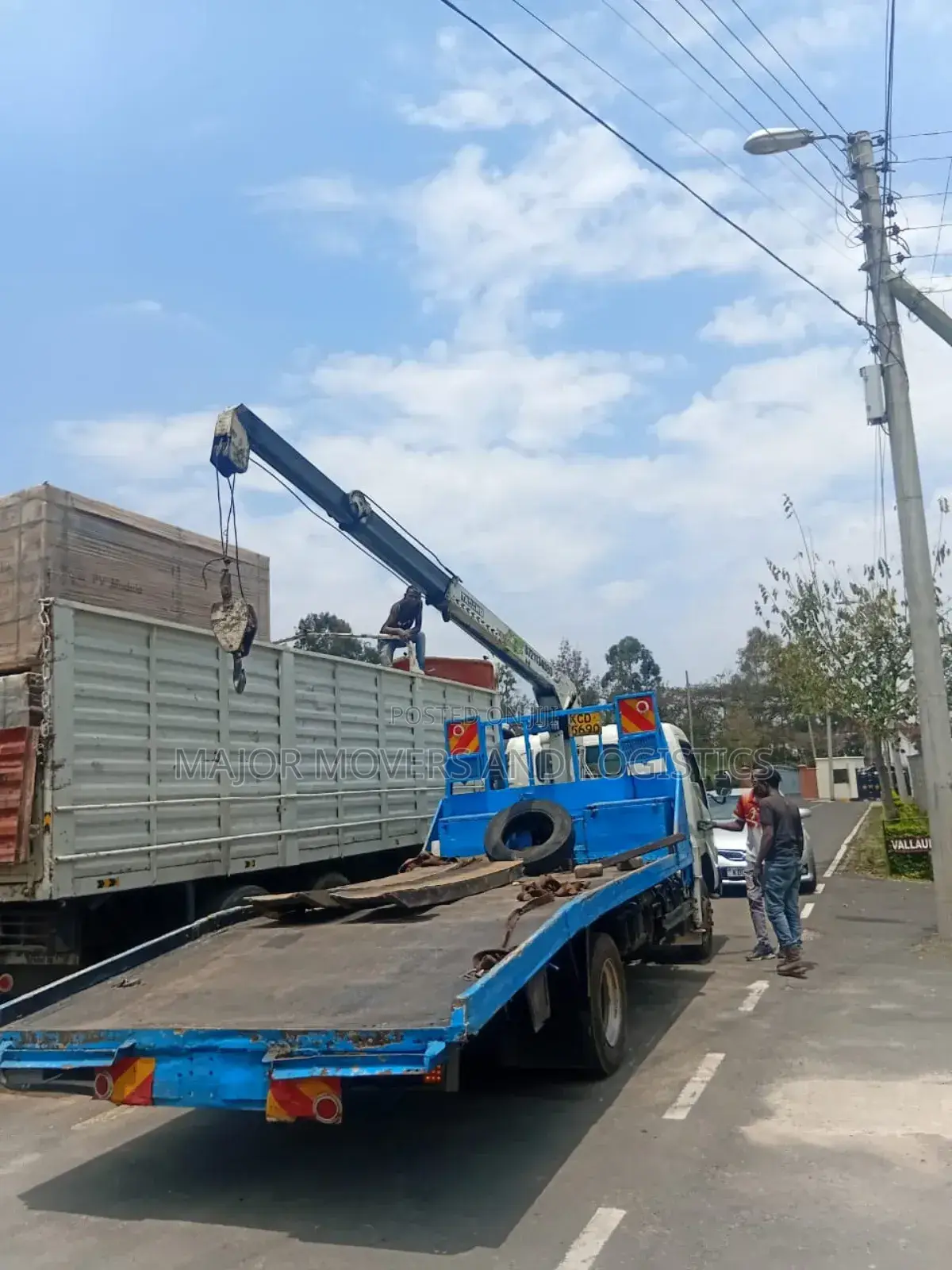 Flatbed Trailer With Crane Are at Hand for Cross Country Delivery