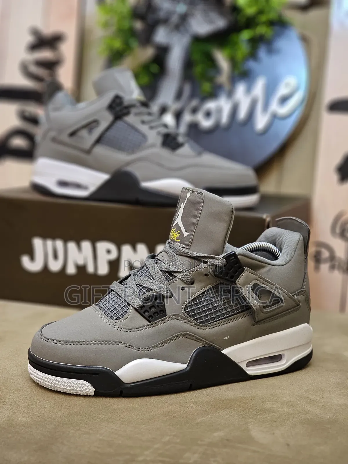 Nike Air Jordan 4 Retro Sneaker In The "Cave Stone" Colorway.