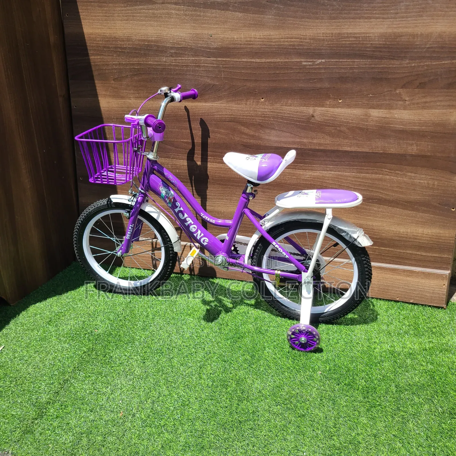 Purple Comet Bicycle With Training Wheels.