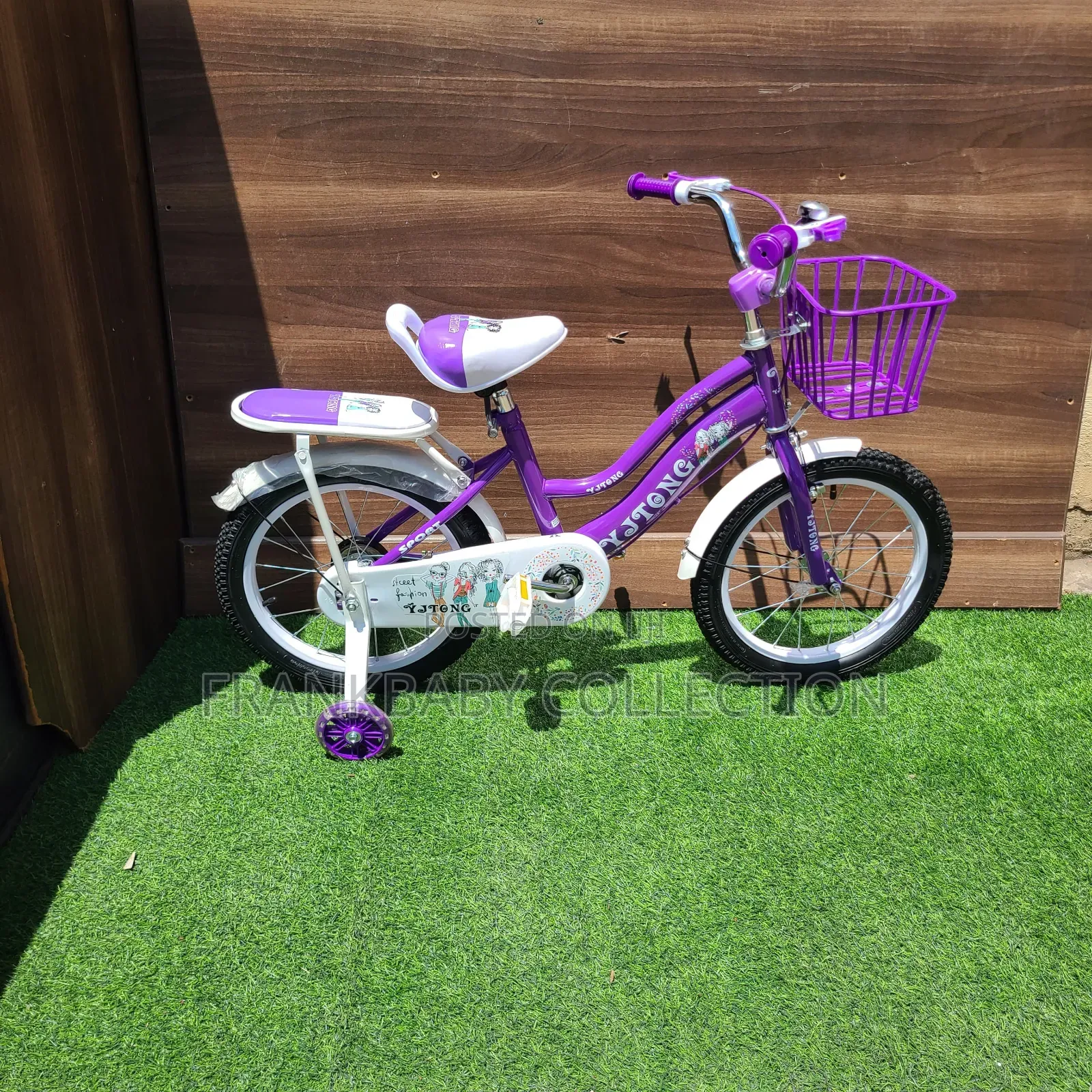 Purple Comet Bicycle With Training Wheels.