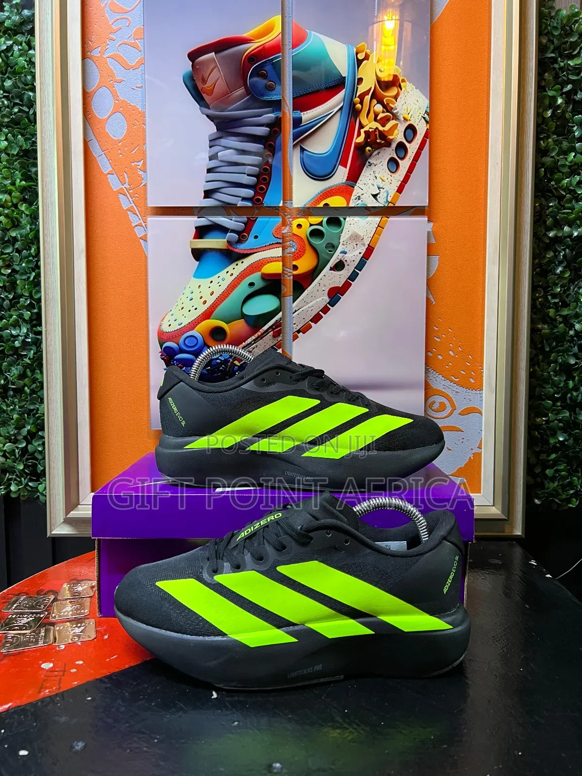 Adidas Adizero Evo Sl Running Shoe In Black With Lucid Lemon Stripes.