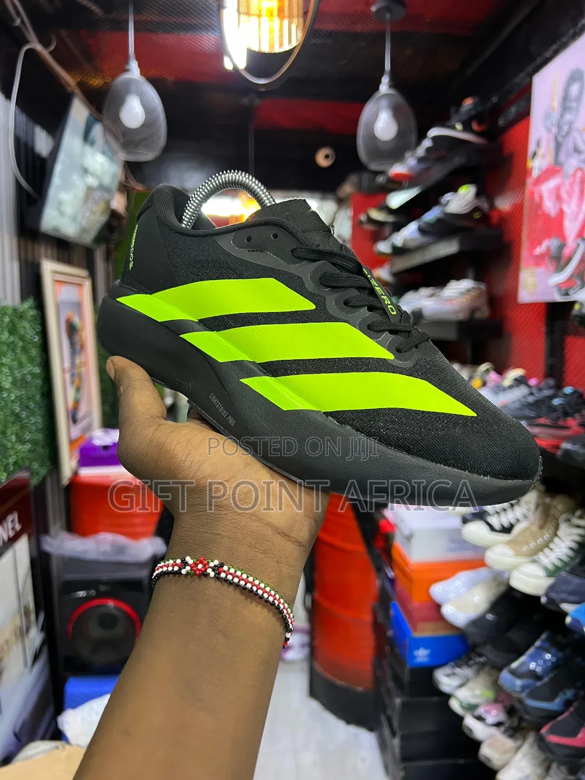 Adidas Adizero Evo Sl Running Shoe In Black With Lucid Lemon Stripes.