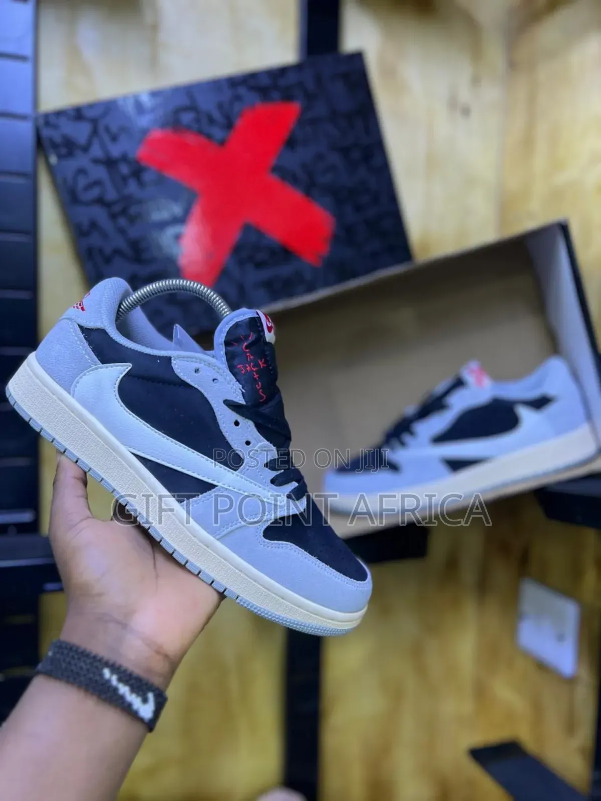 Nike Air Jordan 1 Low Travis Scott In A Black And Grey Colorway.