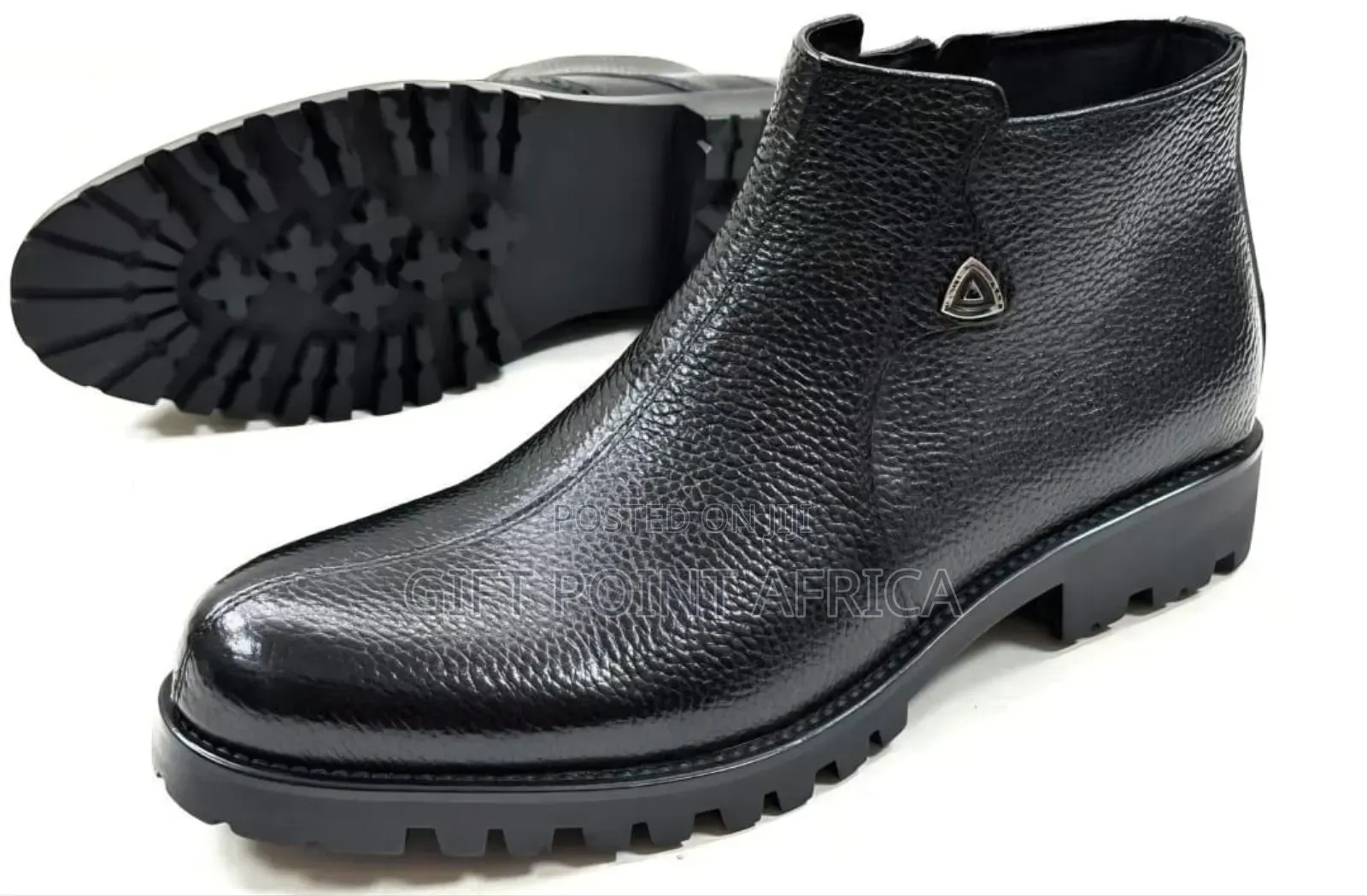 Men's Black Leather Ankle Boots With A Lugged Sole.