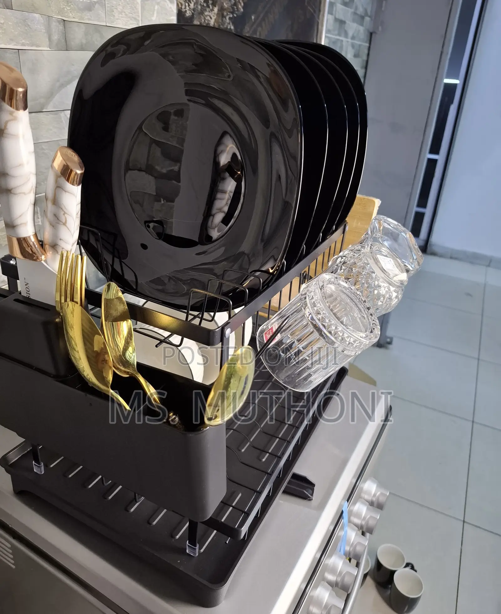 Dish Drying Rack With a Drainboard and Utensil Holder.