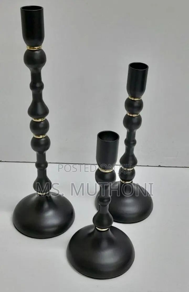 Set of Three Matte Black Metal Taper Candle Holders With Gold Accents