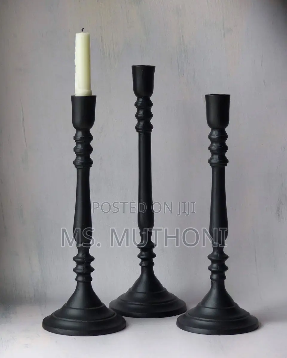 Set of Three Matte Black Metal Taper Candle Holders With Gold Accents