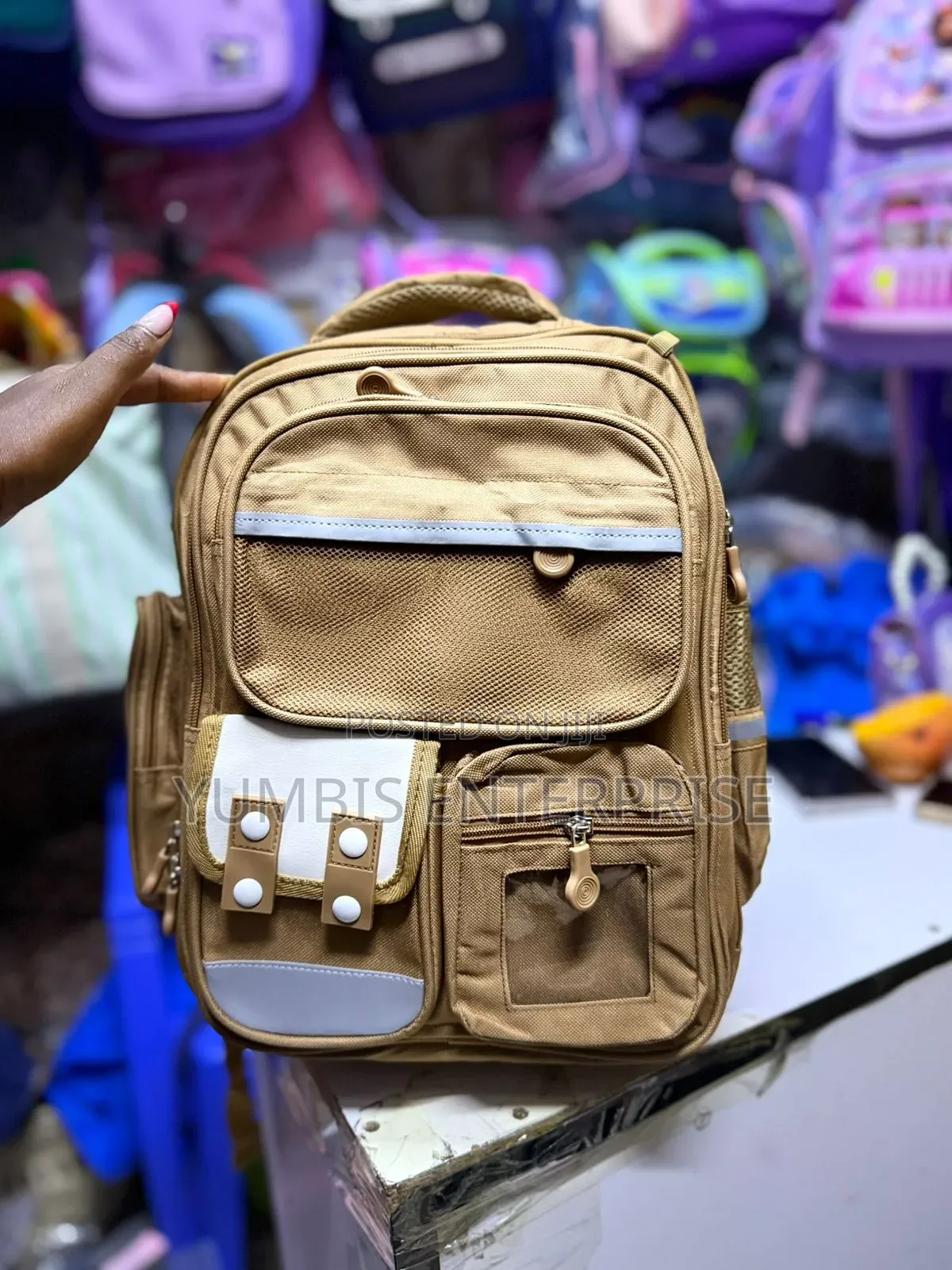 Brown Backpack Grade 1,2,3 at 1200 Each