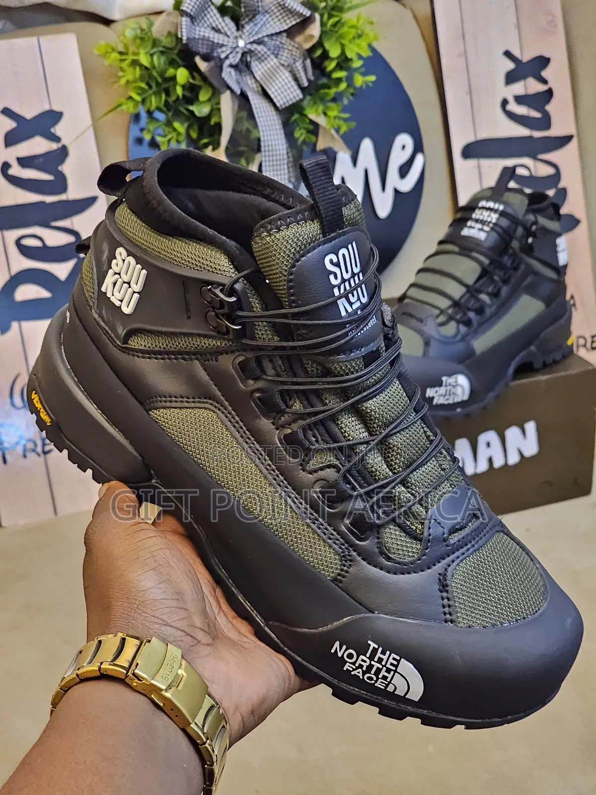 The North Face Hiking Boots In A Green And Black