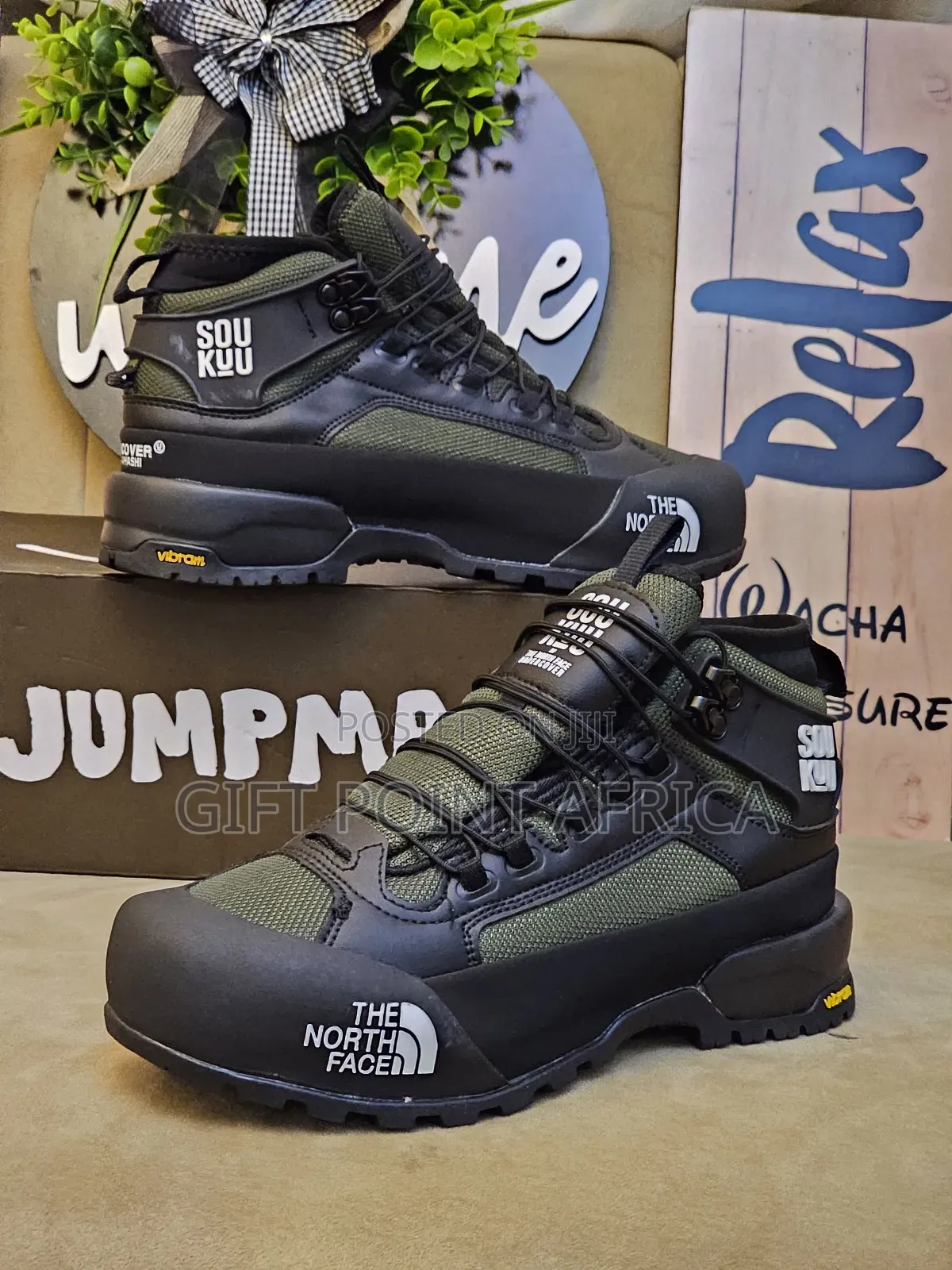 The North Face Hiking Boots In A Green And Black