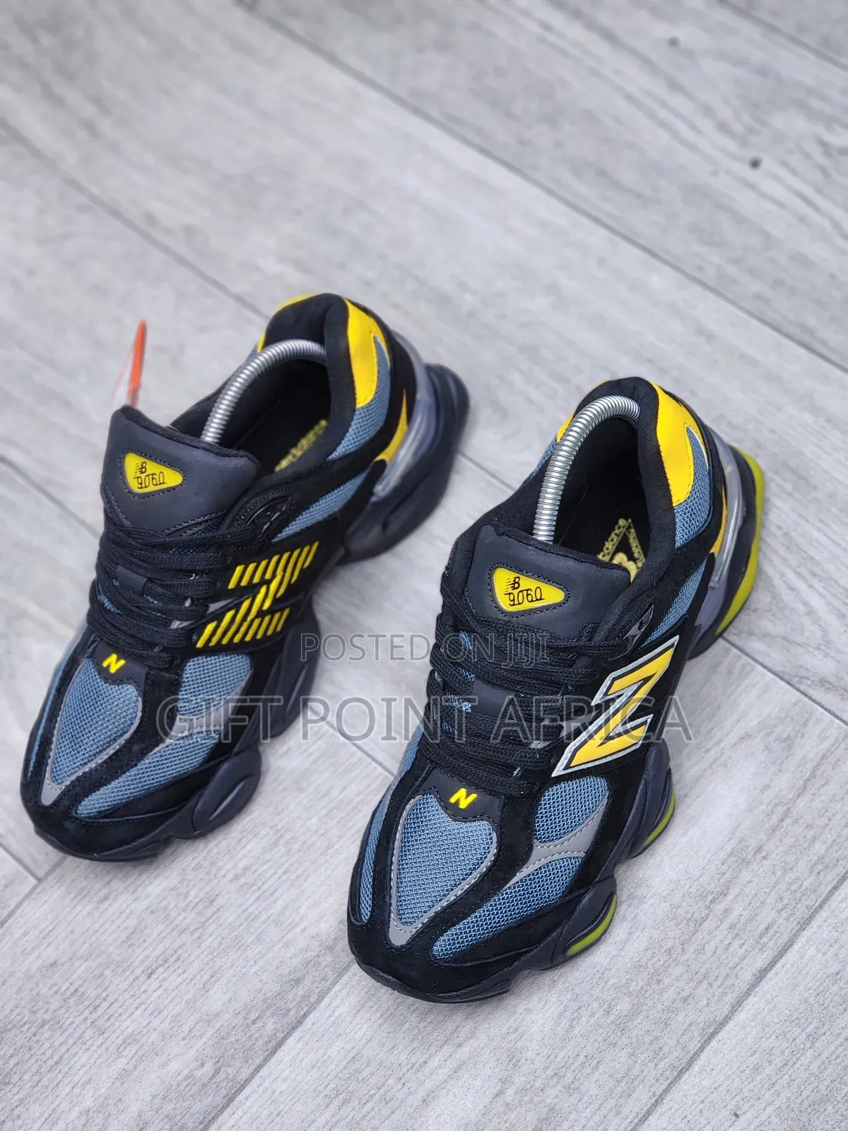 New Balance 9060 Sneakers In A Black, Grey, And Yellow