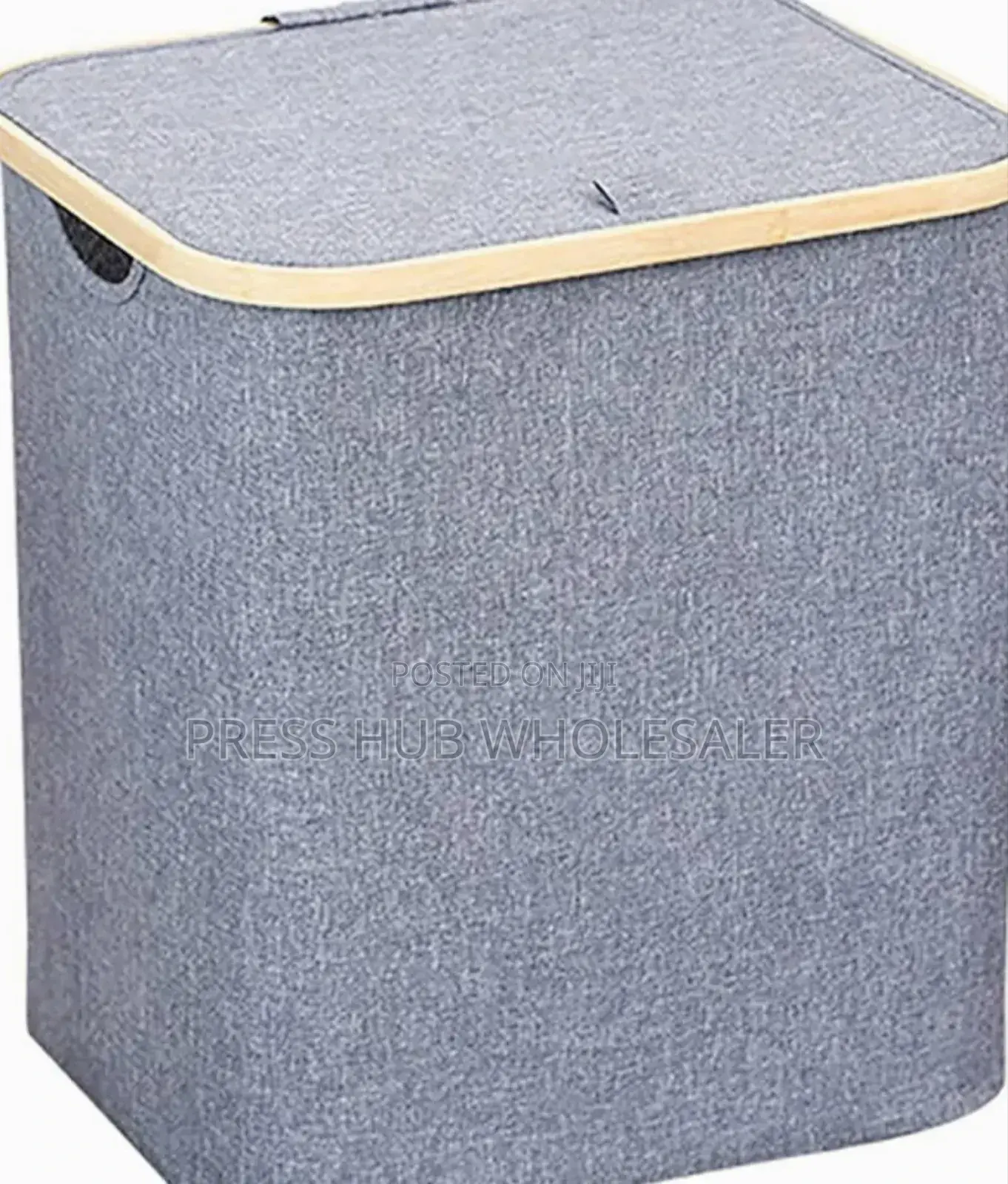 Collapsible Fabric Laundry Hampers With Bamboo-Trimmed Lids.