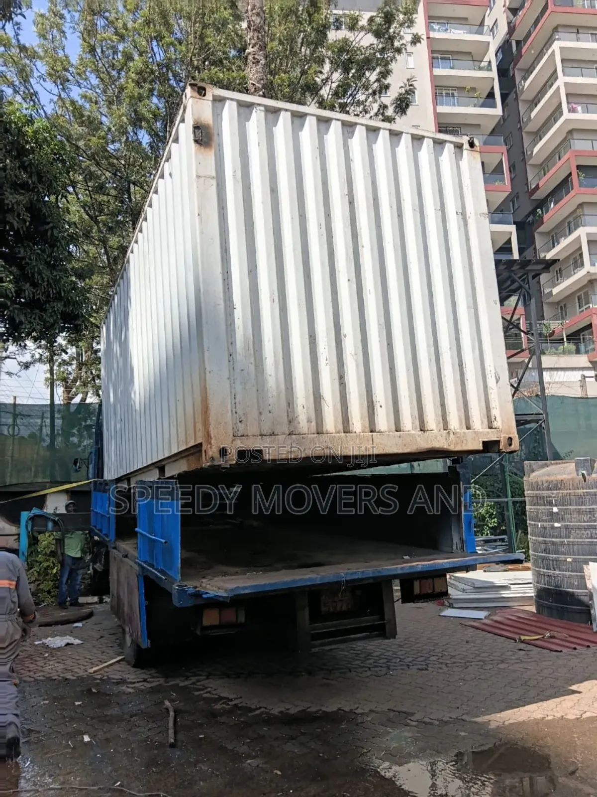 Trucks With Hoisting Cranes Are Available for Delivery and Logistics