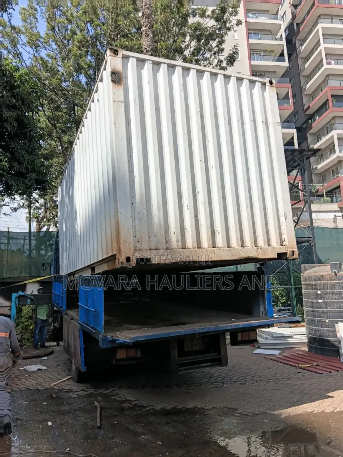 Trucks With Hoisting Cranes Are Available for Delivery and Logistics