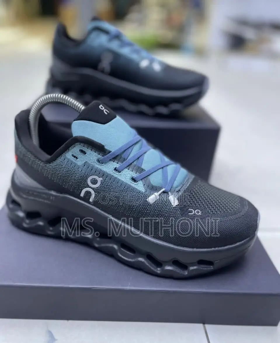 On Cloudtilt Running Shoe in the "Aqua/Iron" Blue White Colorway.