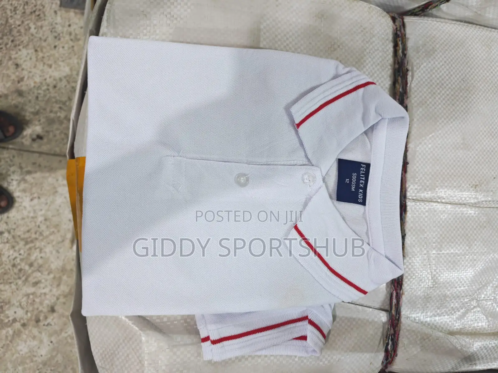 Polo Shirt With Red Stripes on the Collar and Cuffs.