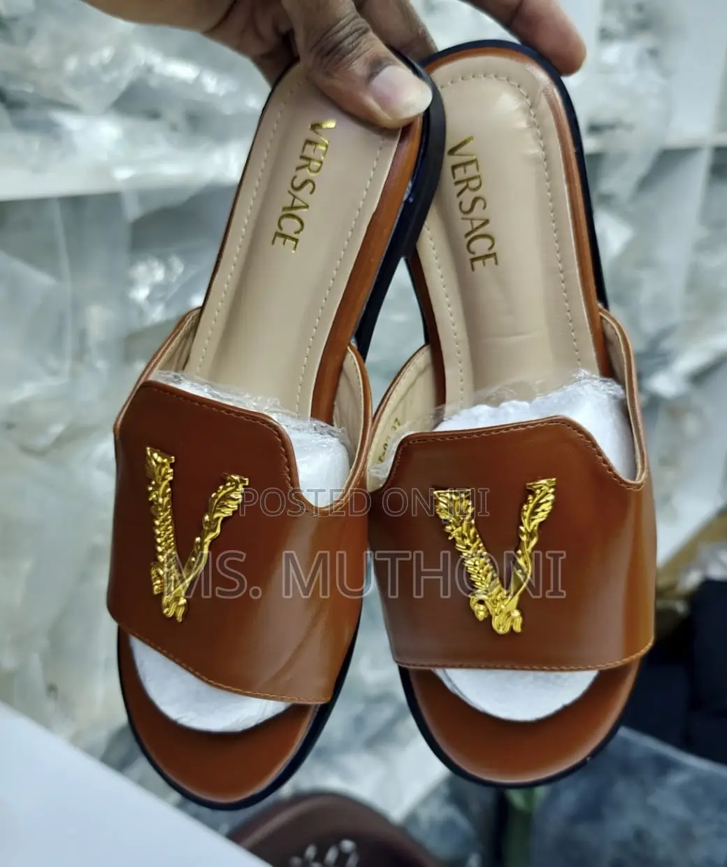 Versace Flat Sandals With a Gold-Tone v Logo Detail.