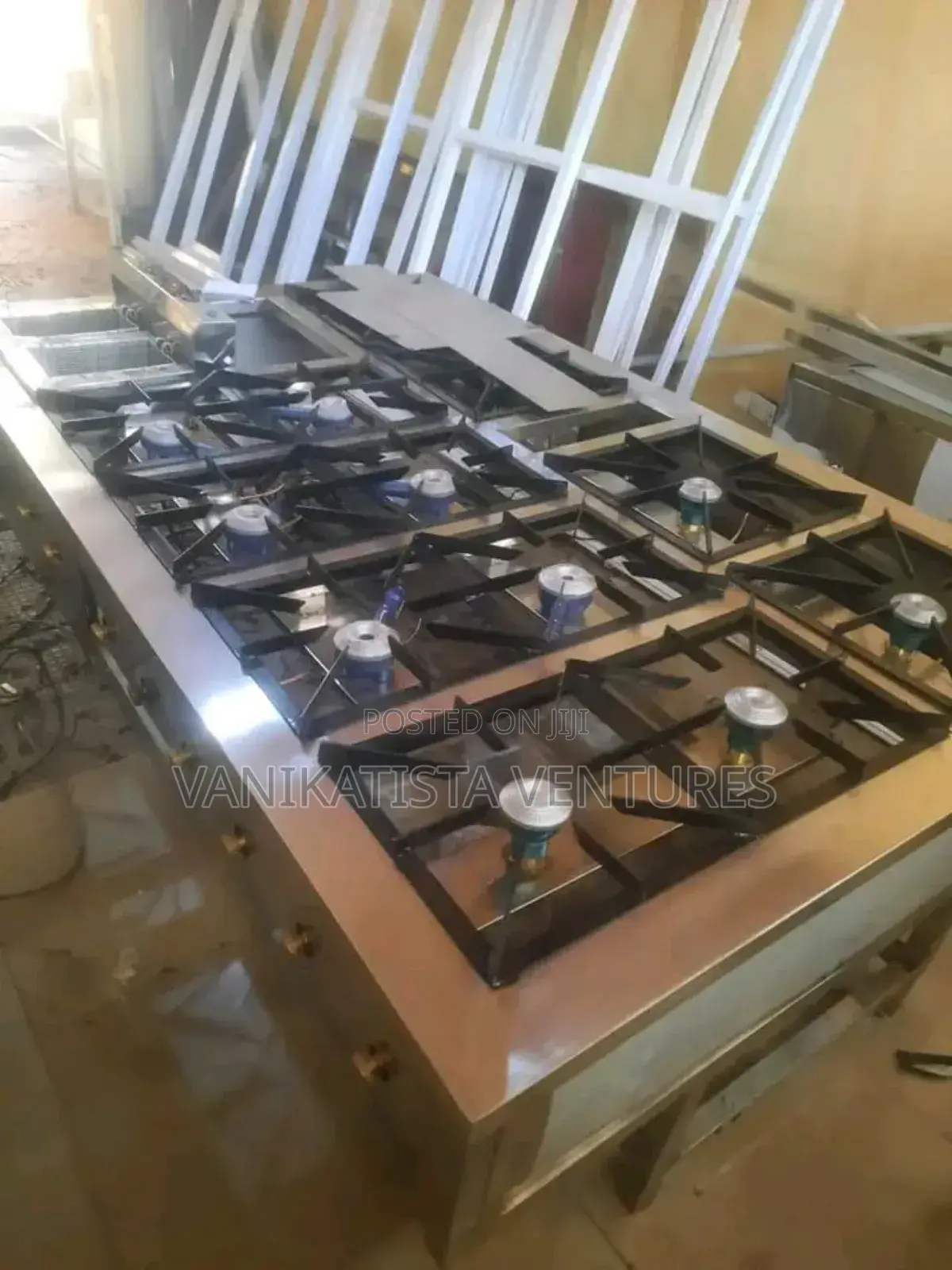 12 Burners Commercial Gas Cooker With a Deep Fryer Machine.
