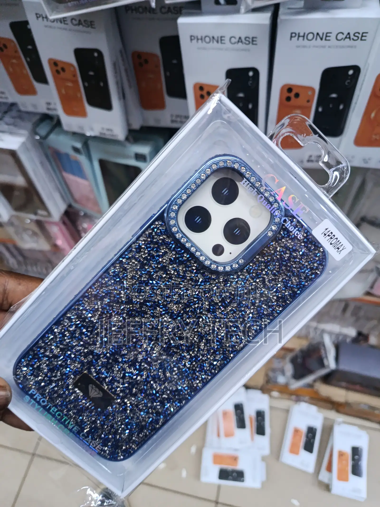 Diamond-Studded Phone Case in Blue, for the Apple iPhone 14 Pro Max.